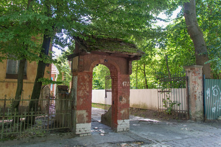 Kaliningrad, Russia - July 31 2019: the view of brick gate to an old building in Amalienau district on July 31 2019 in Kaliningrad, Russia.のeditorial素材