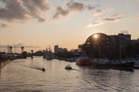 Kaliningrad, Russia - August 02 2019: the view of ships at pier of Pregolya River near World Ocean Museum at sunset light on August 02 2019 in Kaliningrad, Russia.のeditorial素材