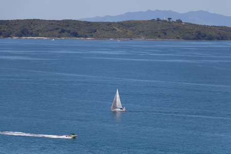 The view of a sailboat in the middle of the sea, New Zealand.