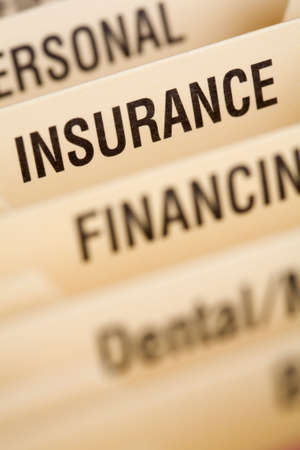 Close up of folder for household bills with focus on insurance sectionの写真素材