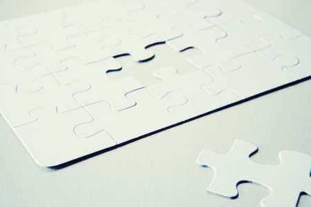 Jigsaw Puzzle With Last Piece In Foregroundの写真素材