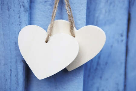Two Wooden Hearts On Blue backgroundの写真素材