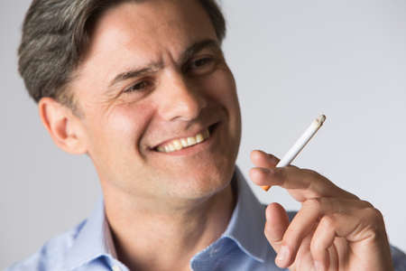 Studio Shot Of man Smoking Cigarette