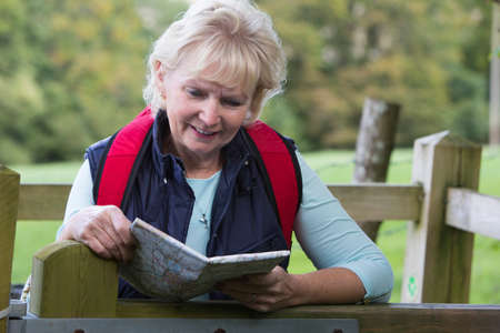Active Senior Woman On Walk In Countrysideの写真素材