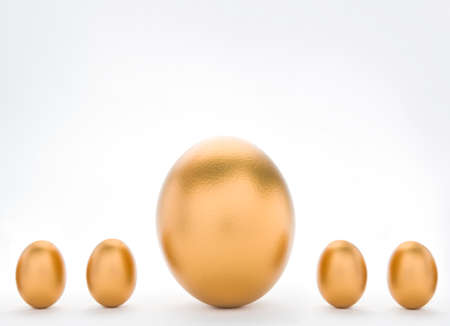 Investment Concept With Large And Small Golden Eggsの写真素材