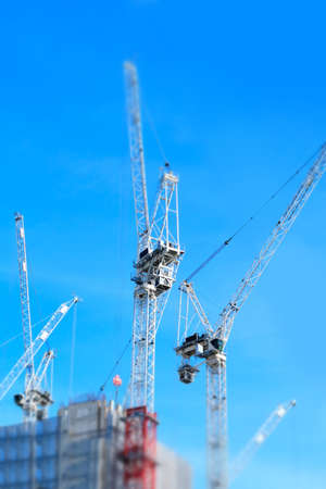 Minaturised Shot Of Construction Site With Cranes Working On Office Buildingの写真素材
