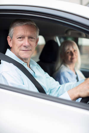 Portrait Of Smiling Mature Couple On Car Journey Togetherの写真素材