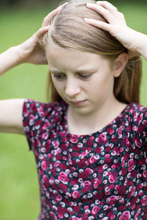 Outdoor Portrait Of Stressed Young Girl