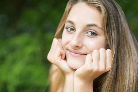 Outdoor Portrait Of Smiling Teenage Girl