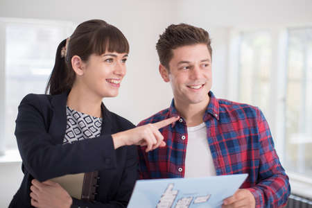 Realtor Showing Man Around Property For Saleの写真素材