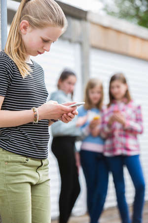 Pre Teen Girl Being Bullied By Text Messageの写真素材