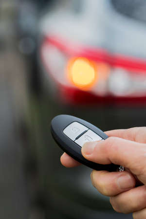 Close Up Of Driver Activating Car Security System With Key Fobの写真素材