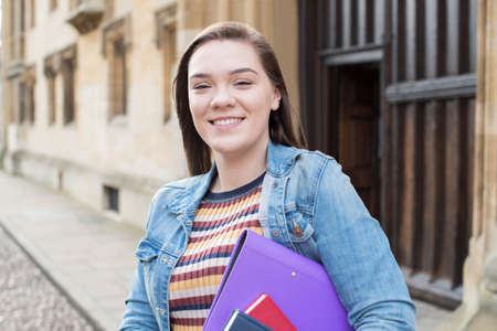 Portrait Of Female University Student Standing Outside Buildingの写真素材