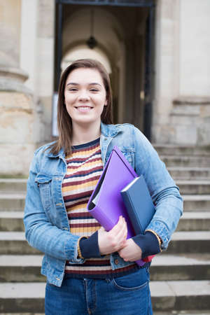 Portrait Of Female University Student Standing Outside Buildingの写真素材