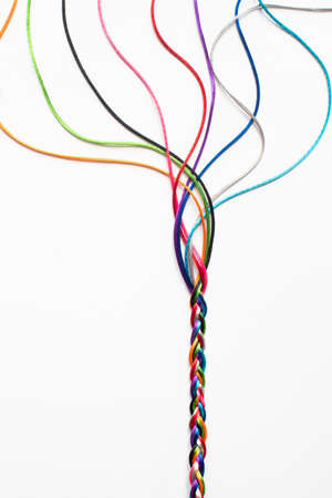 Coloured String Woven Together To Illustrate Concepts Of Unity Society Togetherness and Cooperationの写真素材