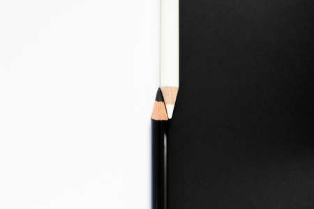 Black And White Pencils Against Contrasting Background To Illustrate Racial Diversity Conceptの写真素材