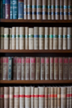 Defocused Shot Of Legal Books On Shelf In Office Of Lawyer Soliciitor Or Attorneyの写真素材
