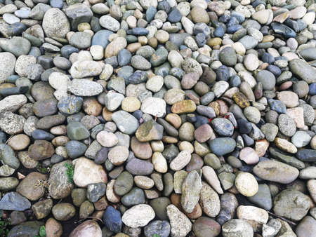 Beautiful pebbles, romantic setting by the sea.の写真素材