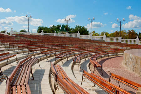 Benches facing a semicircle in front of the stageの写真素材