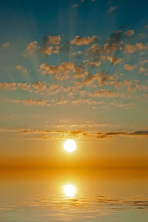 sunset at sea during a calmの写真素材