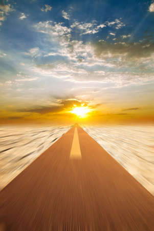 Road to sunset, blurred by movementの写真素材