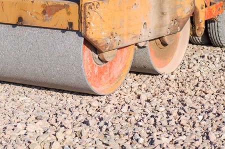 Part of the old road rink prepares the roadway for asphaltの写真素材