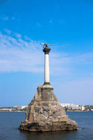 Monument to the flooded ships in Sevastopol on the background of the bay and blue sky. Memorable compositionの写真素材