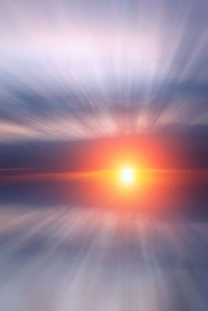 Bright beautiful sun and sunset with clouds over the sea on the calendar. Abstract Dawn compositionの写真素材