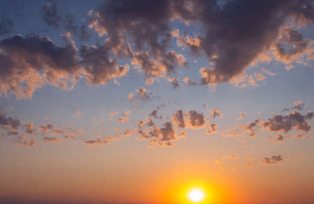 Sunset against the backdrop of dramatic clouds. Natural sunrise compositionの写真素材