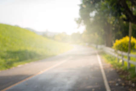 Blurred photograph of street in the countryside backgroud.の写真素材