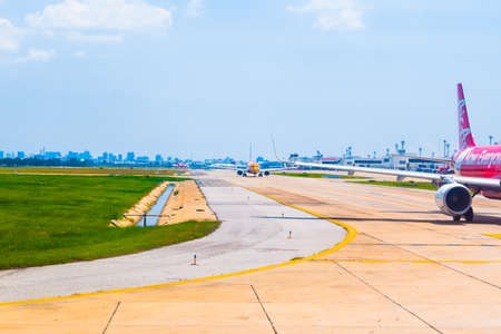 Bangkok, Thailand - April 13, 2017: Thai Airasia and Nok Air parked at Don Mueang International Airport in Bangkok, Thailand.のeditorial素材