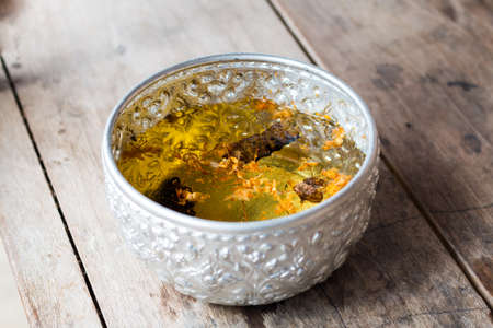 Pour water on the hands of revered elders and ask for blessing in Songkran Festival, Thailand.の写真素材