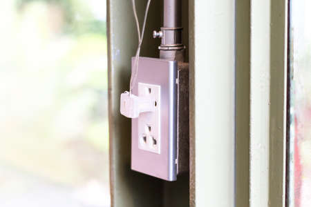 Electric gray socket and white plug, Modern style double plug socket.の写真素材
