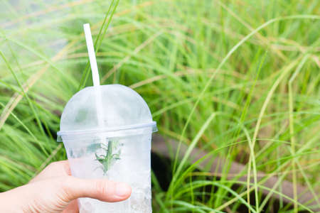 Plastic glass handle, Plastic glass on nature background.の写真素材