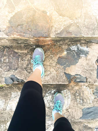 Start healthy lifestyle young fitness woman at sunrise on staircase.の写真素材