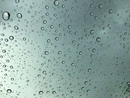 Rain drop on car glass abstract background, Vintage tone.の写真素材