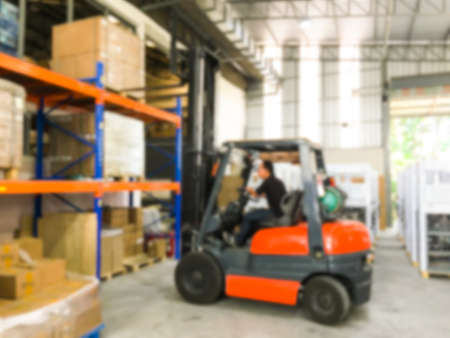 Blurred image, Forklift loader for warehouse works indoors loading in shelfの写真素材
