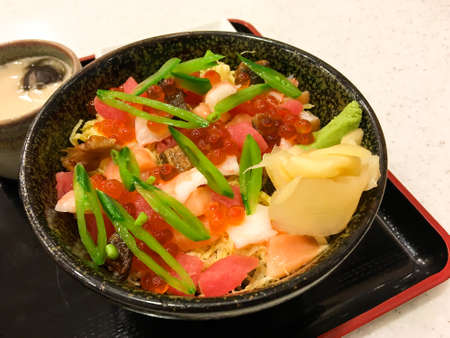 Salmon roe japanese ingredient on rice on table.の写真素材