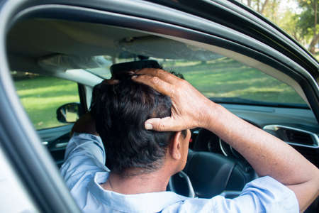 Driving men is strain on the road.の写真素材