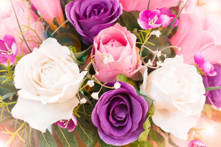Valentines Day background with pink rose, white rose, purple rose and bokeh lights.の写真素材