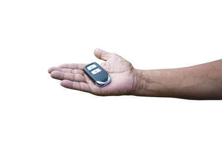 Close up car remote key on hand, Isolated, White Background.