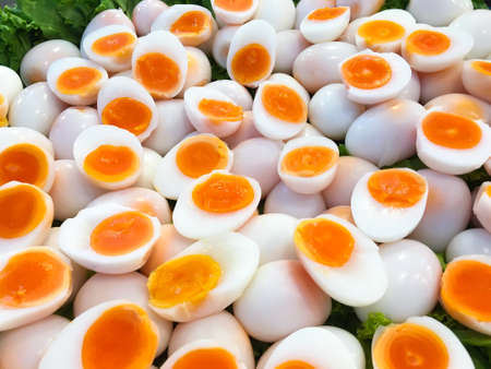 Medium soft boiled egg sliced in the market Thailand.の写真素材