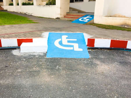 Disabled symbol pathway for wheelchair ramp in place background texture.の写真素材