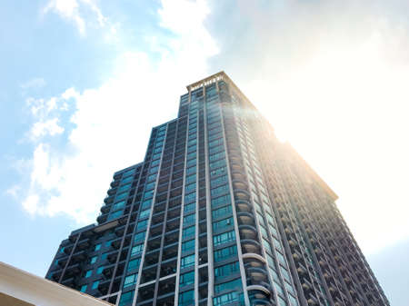 Modern condominium building of the sunlight in the blue sky background texture.の写真素材