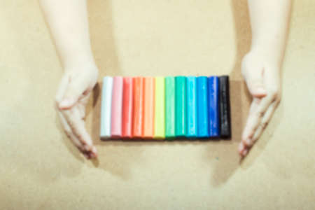 Blur image little hand entwine colorful clay vintage tone background texture.の写真素材