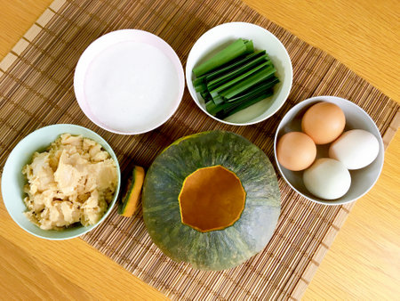 Thai dessert homemade, mix egg with coconut milk, sugar and pandan in pumpkin sweet, pumpkin custard.の写真素材