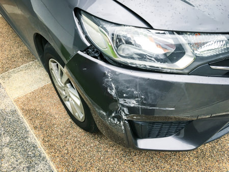 Top view front of car crash accident on the road, closeup scratched and damaged automobiles.の写真素材