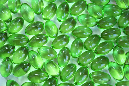 Green capsulesの写真素材