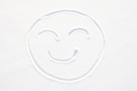 Smiley face in the snowの写真素材