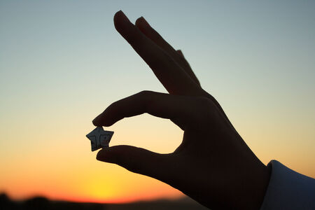Holding an star shaped silhouetteの写真素材